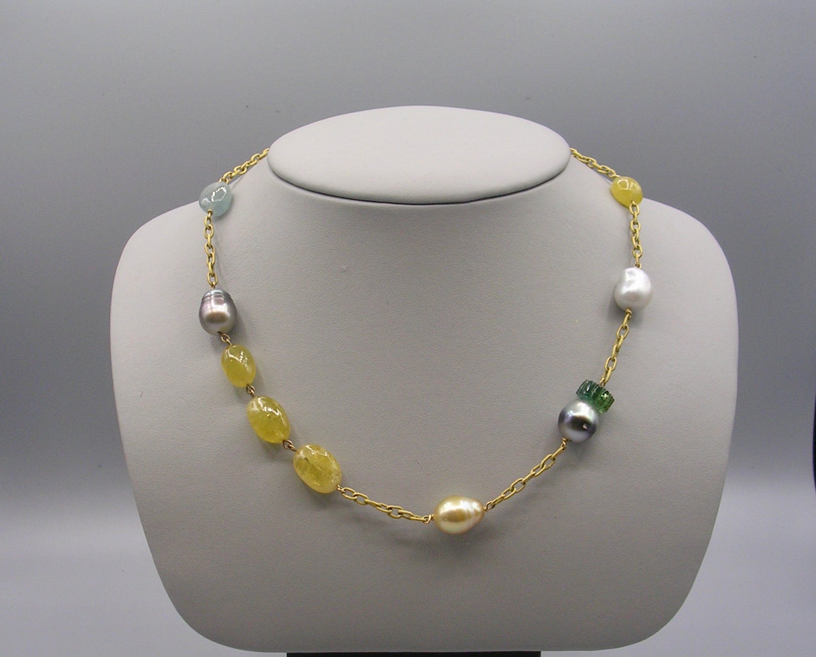 Necklace with South Sea pearls, black Tahitian pearls, carved tourmaline and aquamarines